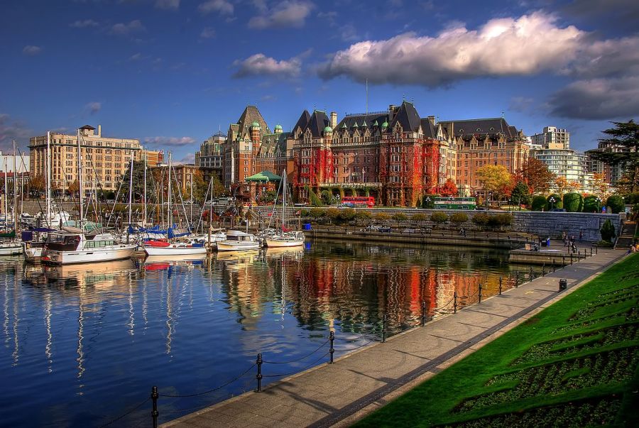 Large waterfront buildings by harbor in Victoria, BC